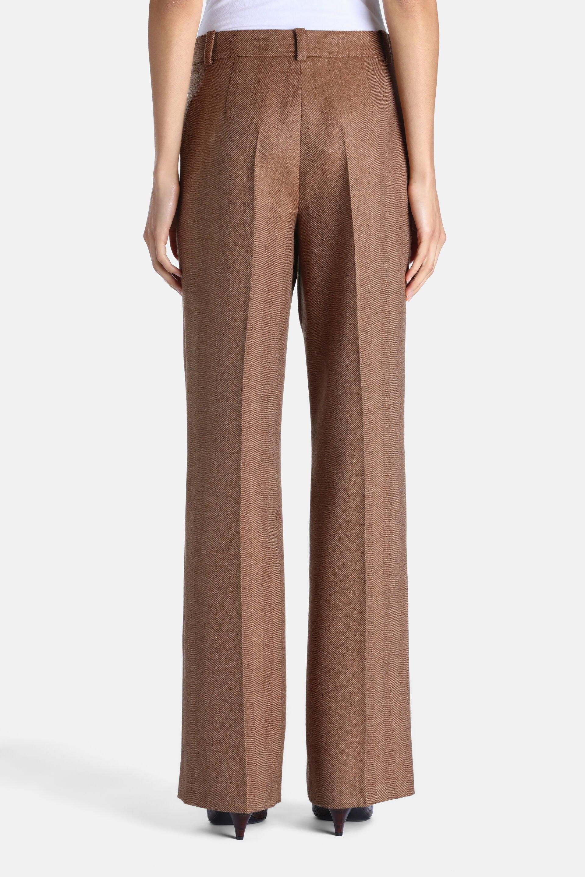 Brown herringbone wide-leg trousers with front creases and belt loops.