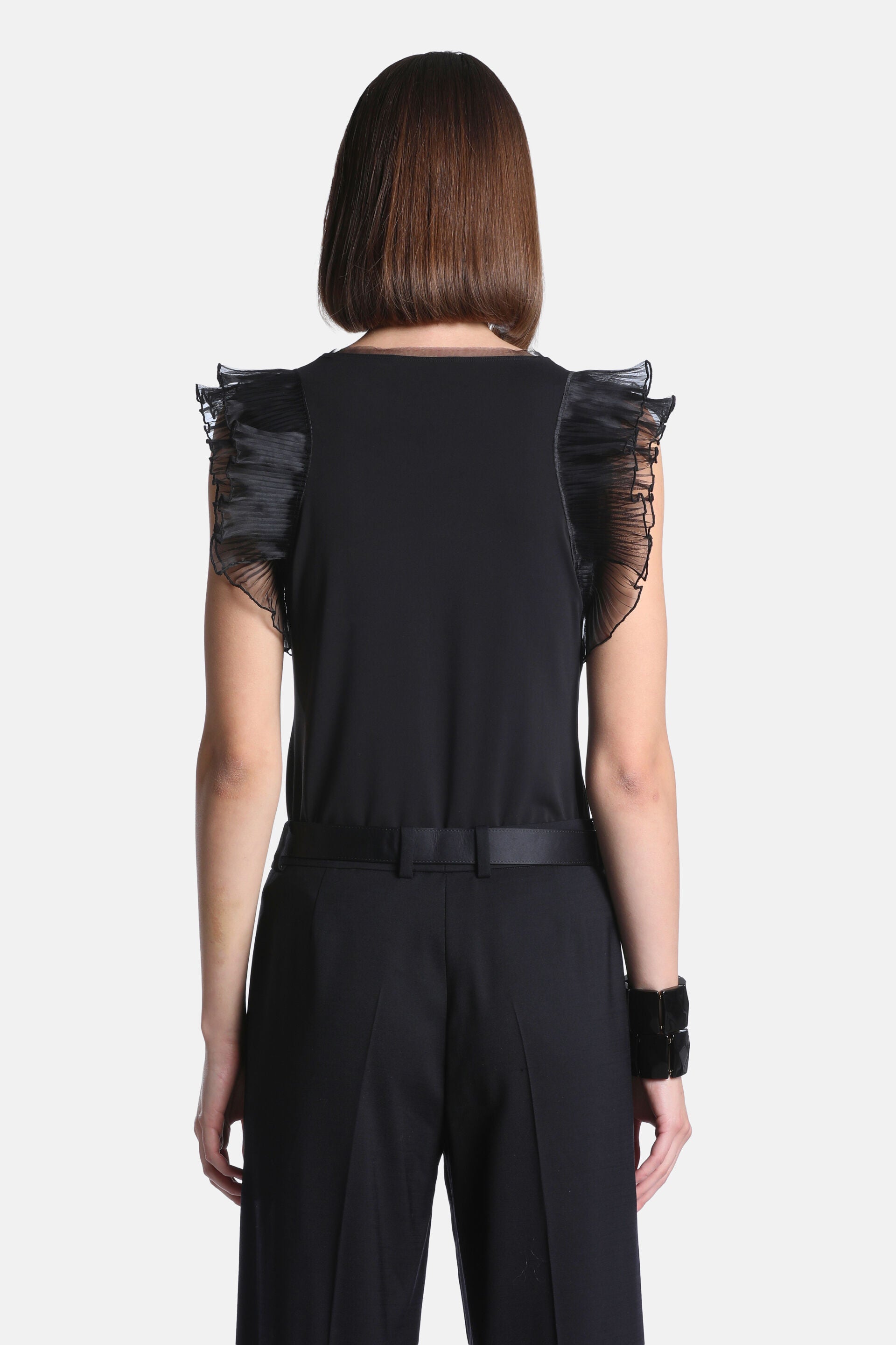 Black women's top with a round neck and short cap sleeves featuring layered, ruffled, sheer pleated fabric.