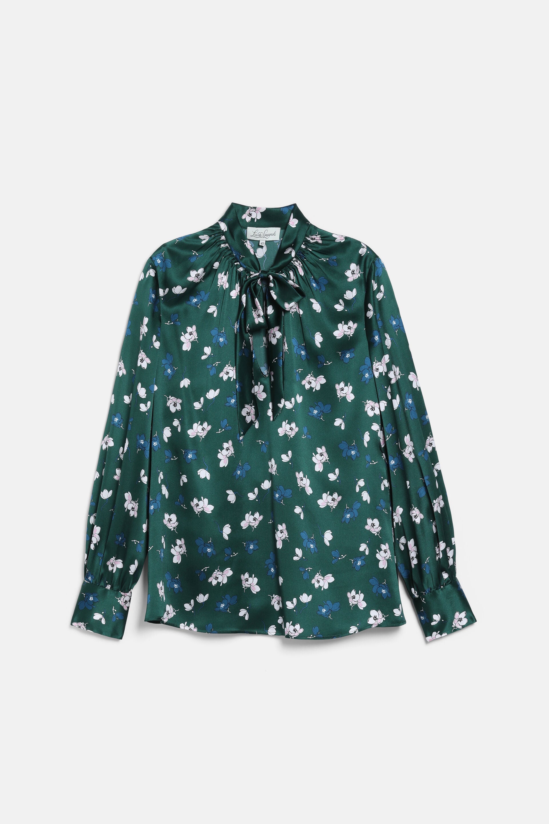 Dark green satin blouse with white and blue floral print, a high neck with a tie-bow, and long cuffed sleeves.