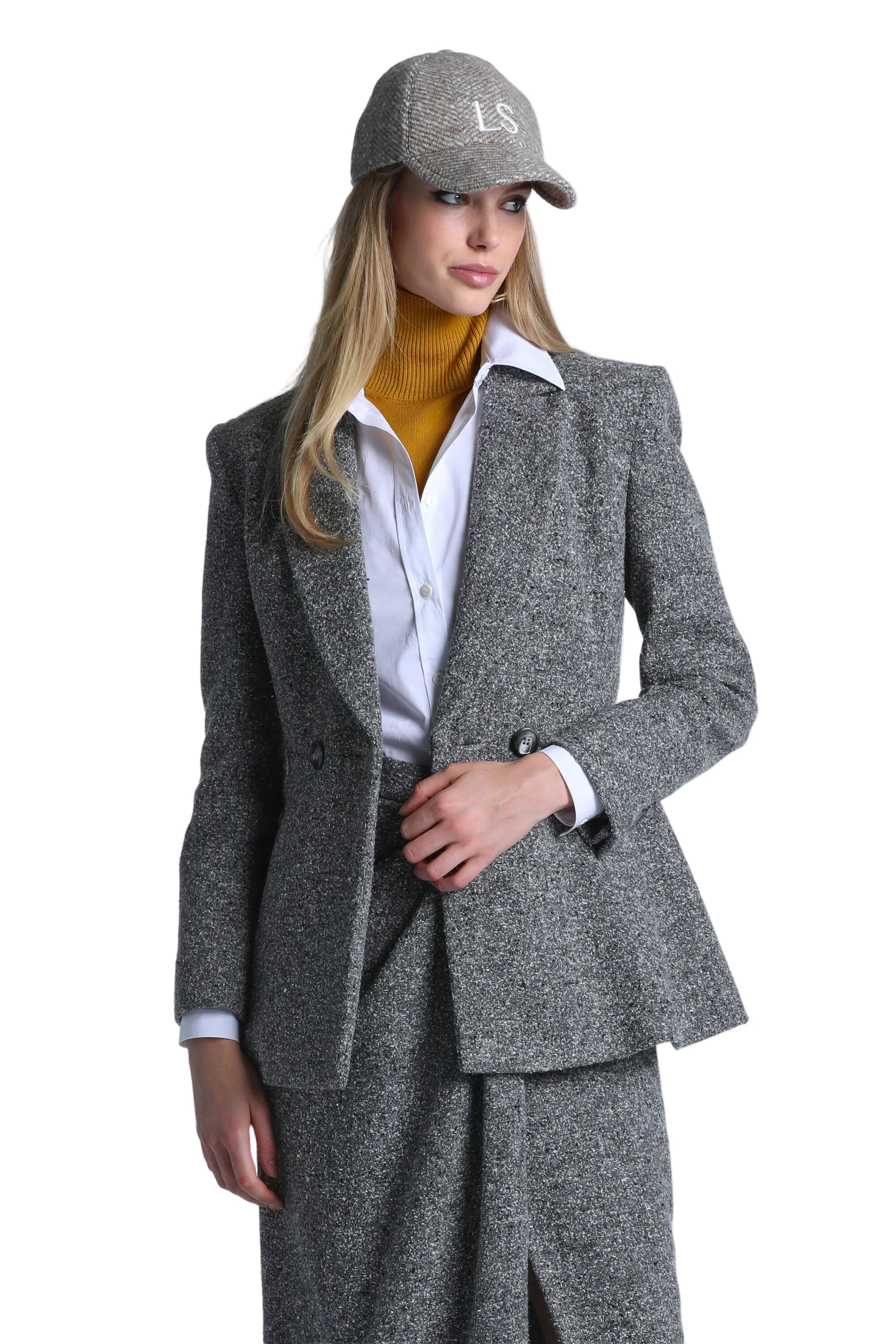 Grey-cream speckled double-breasted jacket with notched lapels, two dark buttons, and a slightly flared hem.