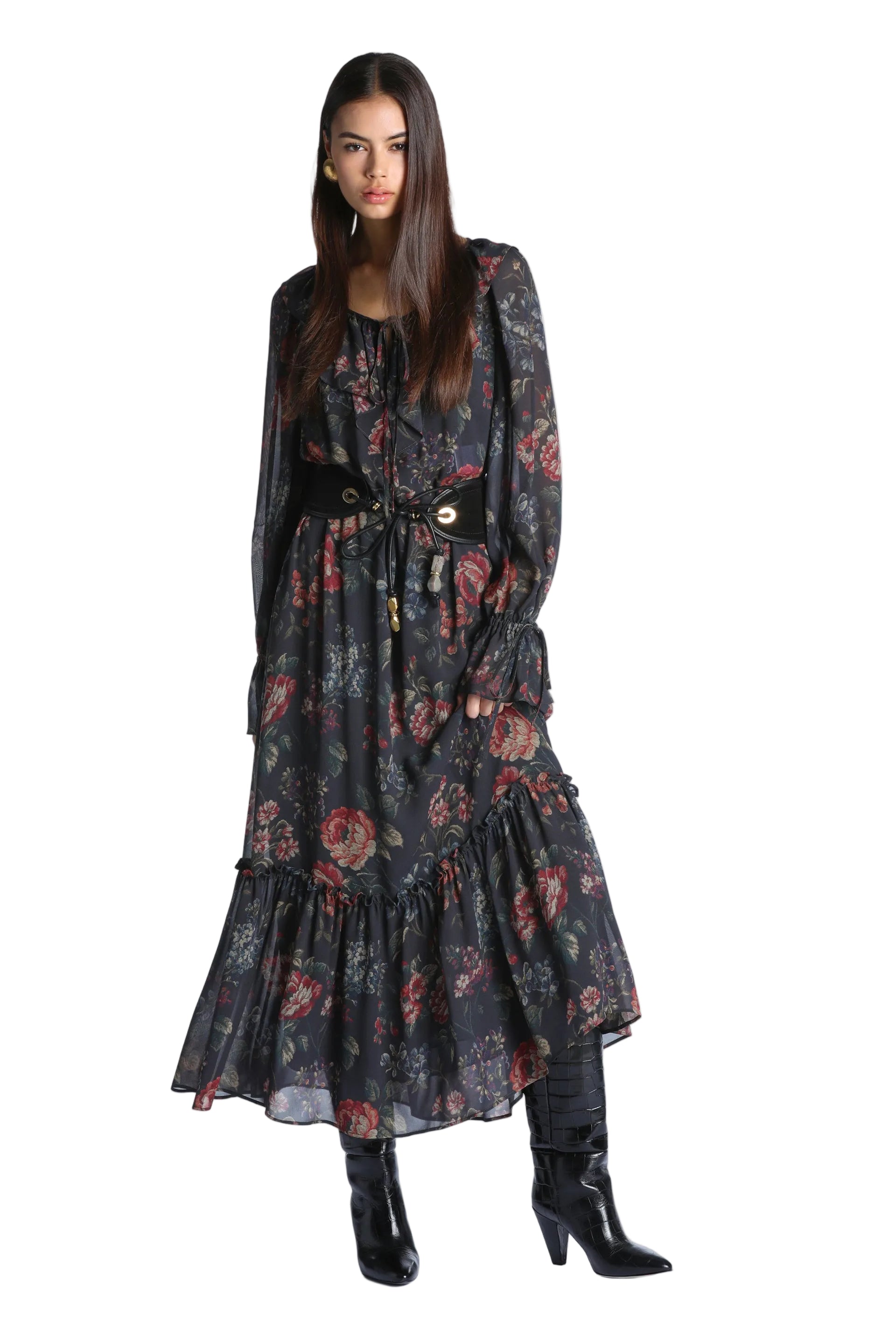 Long-sleeved maxi dress in dark brown with a vibrant red and blue floral print, featuring a ruffled hem and tie-neck.