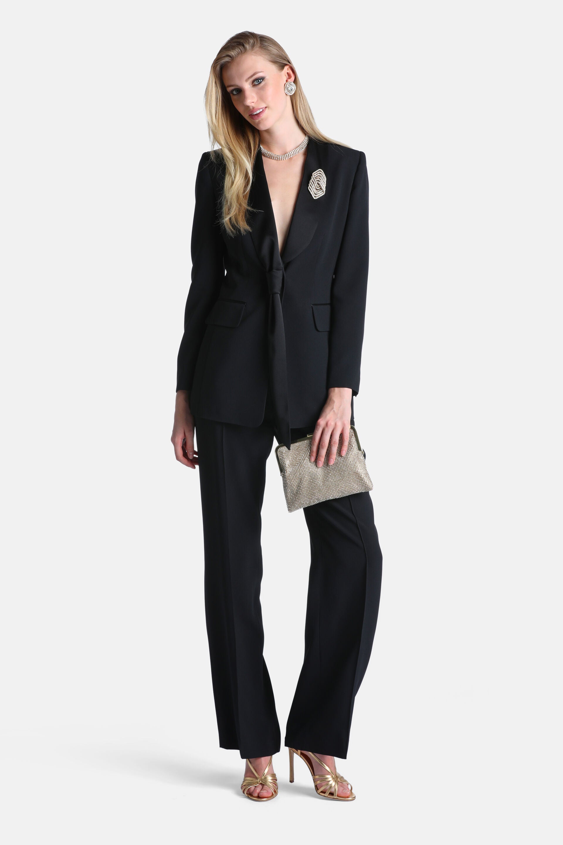Black full-length trousers with a straight-leg cut and smooth fabric.
