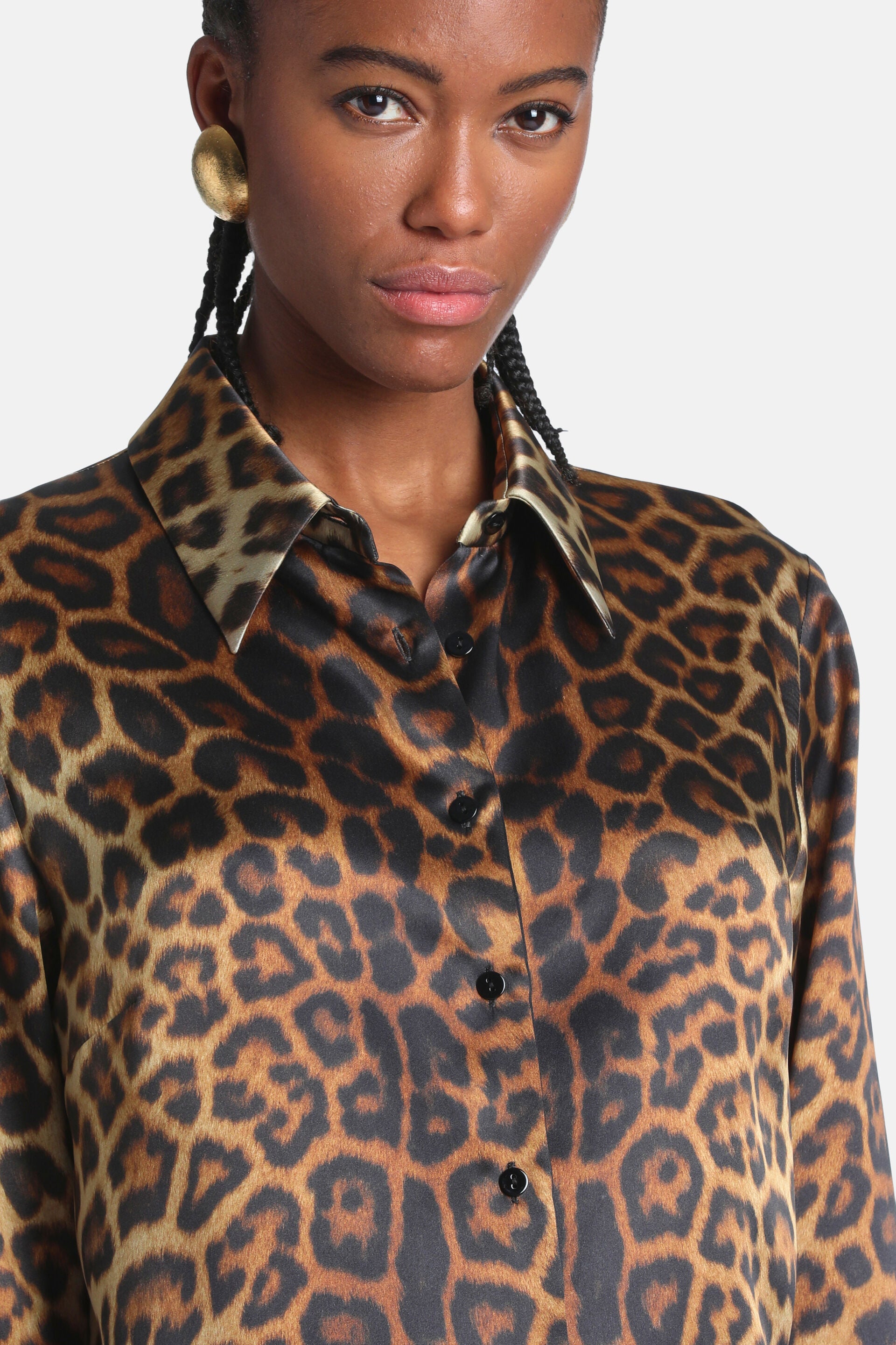 Silk leopard print shirt with a pointed collar and black front buttons.