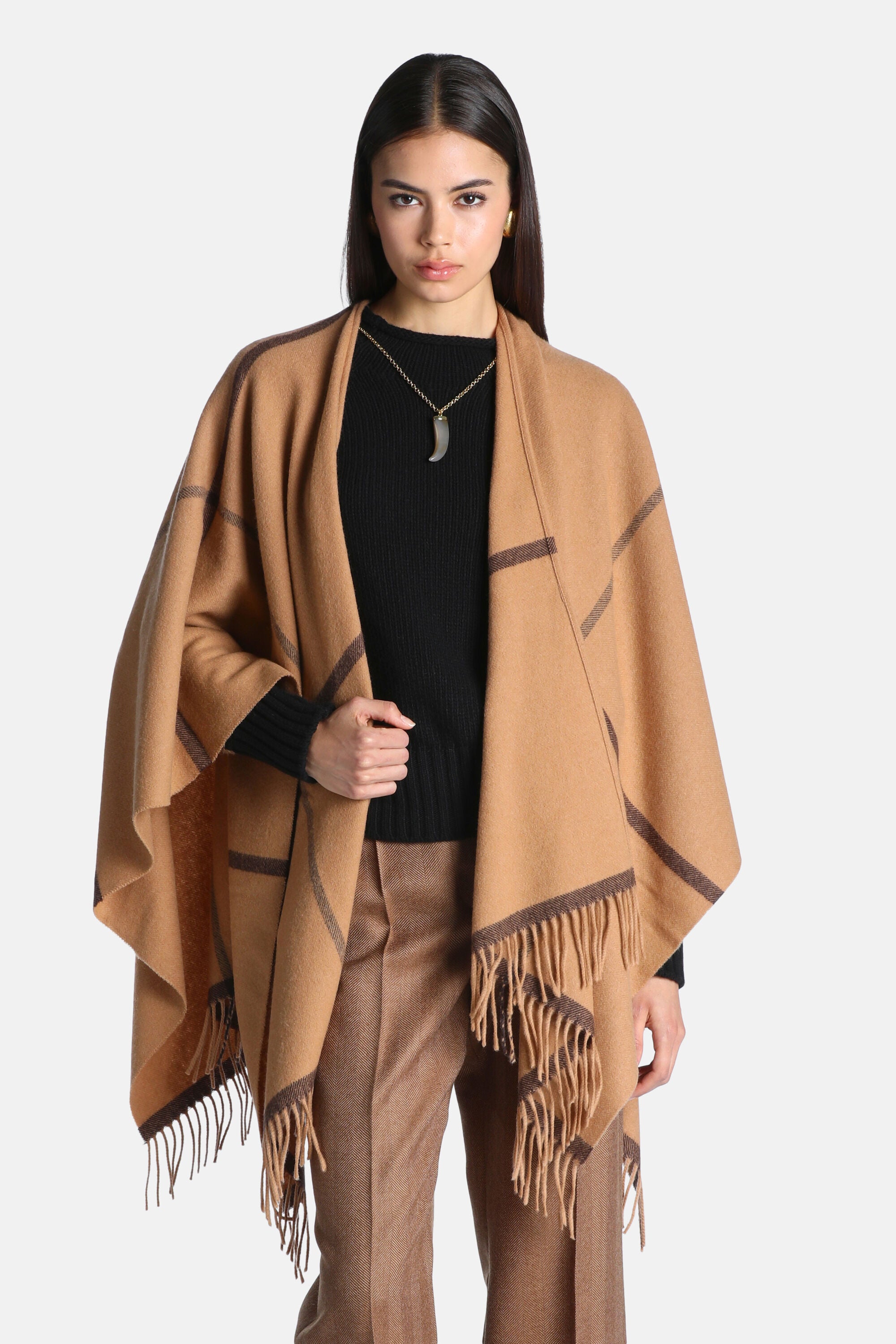 Tan open-front cape with dark brown intersecting stripes and fringe along the edges. Made of soft, woven fabric.
