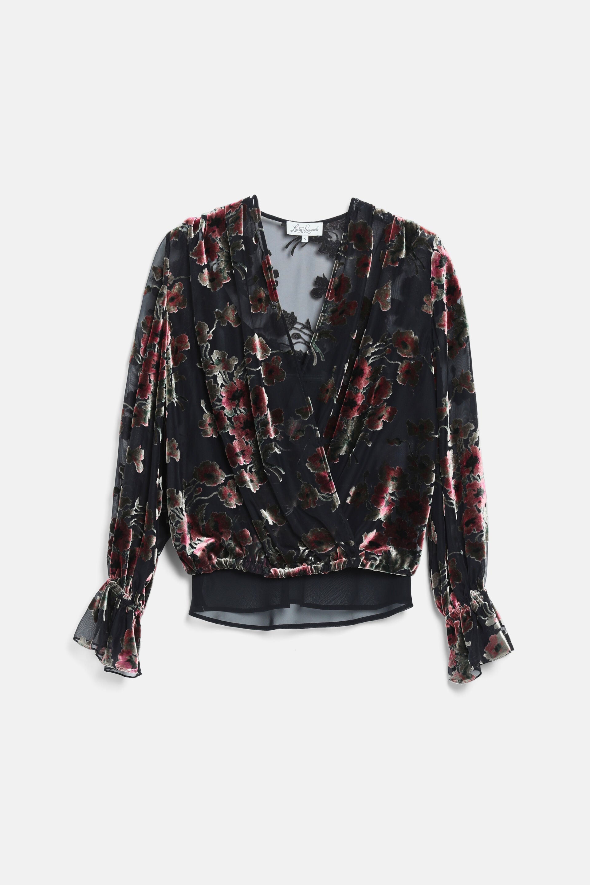 Black sheer blouse with pink and green velvet floral pattern, V-neck, wrap front, elasticated hem, and ruffled cuffs.