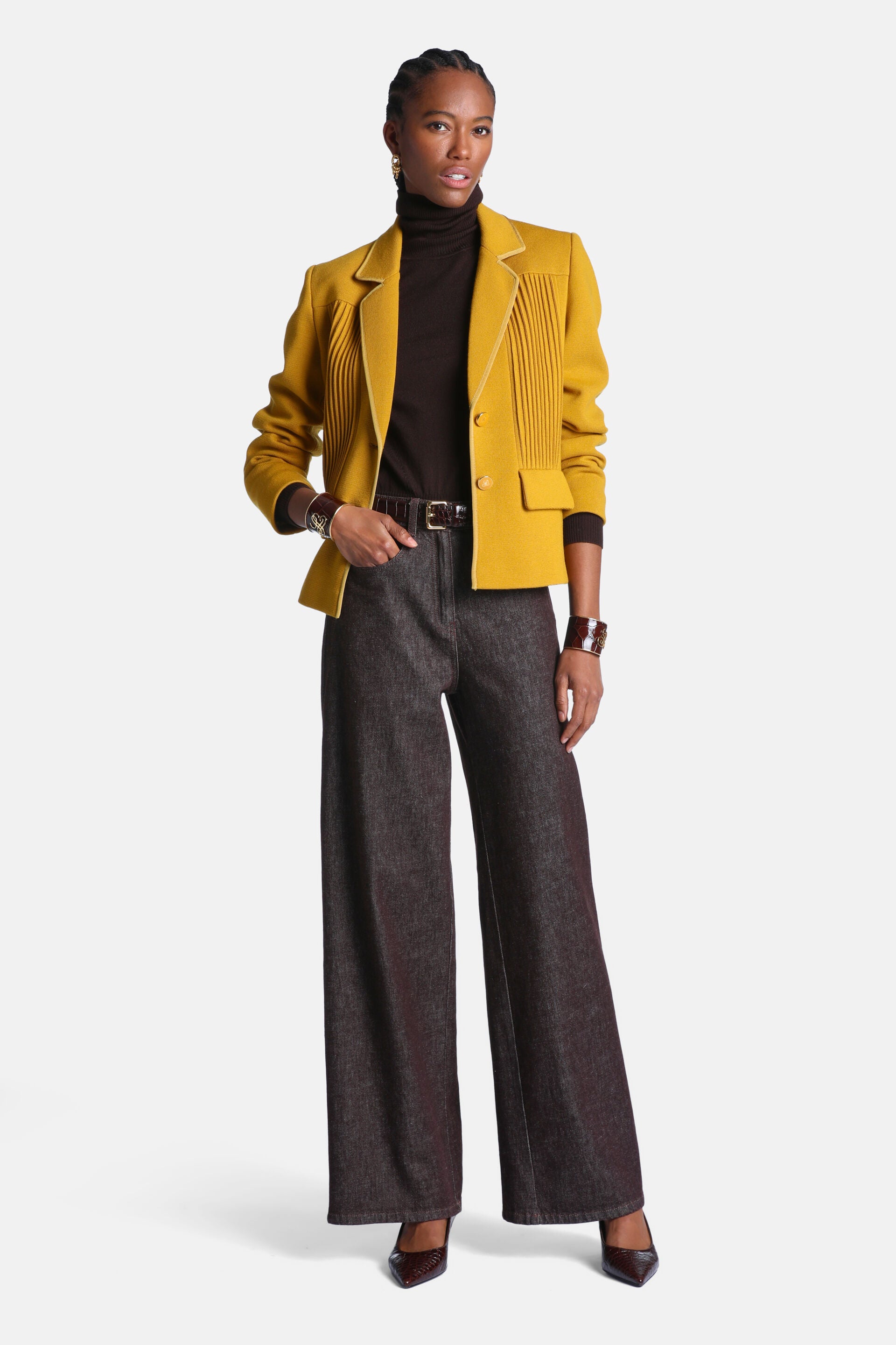 Dark brown, high-waisted, wide-leg trousers made of a sturdy fabric.