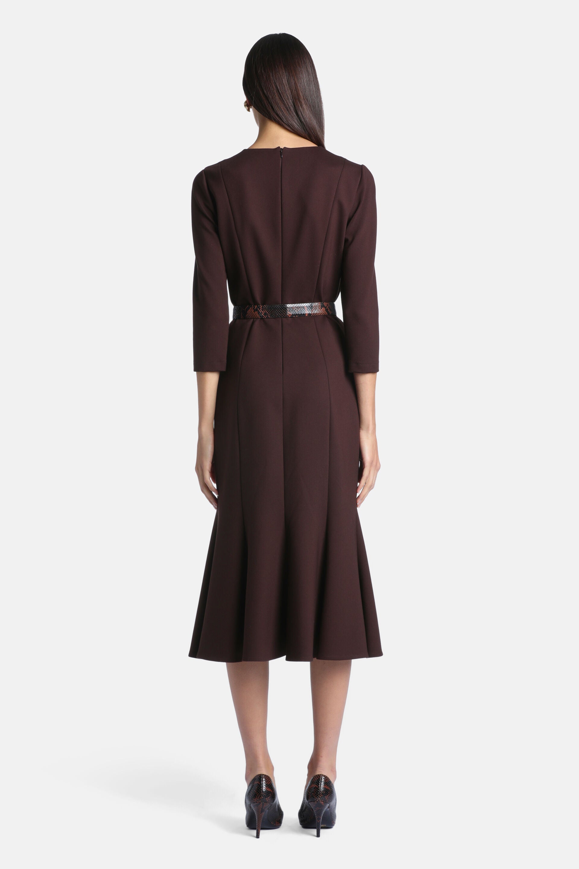 Dark brown midi dress with 3/4 sleeves, back zipper, and a flared skirt. Features a brown snakeskin-patterned belt.