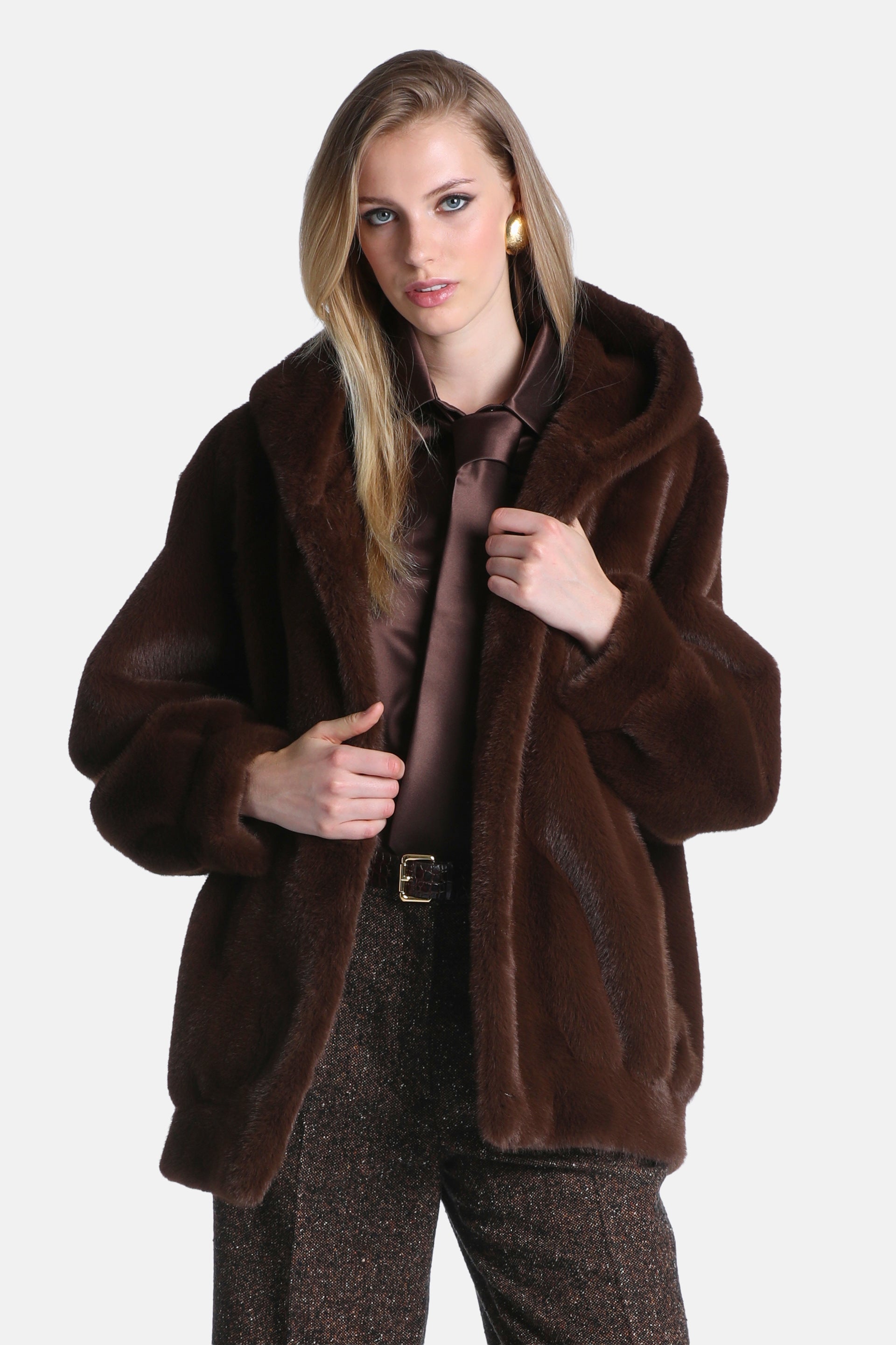 Dark brown faux fur hooded jacket with long sleeves and cuffed ends. It has a loose fit and an open front.