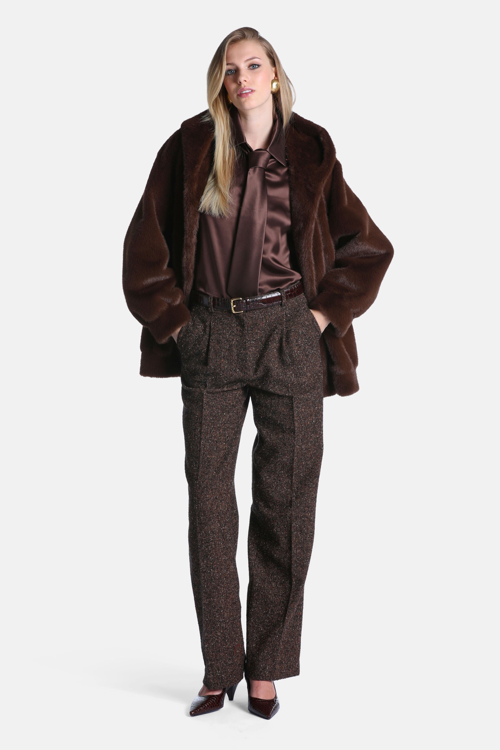 Dark brown faux fur hooded jacket with a relaxed fit and full, slightly voluminous sleeves.