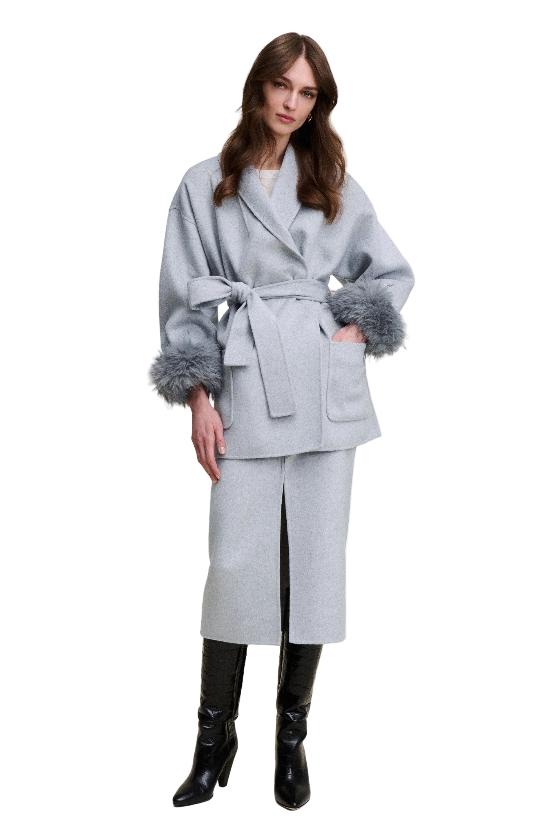 Light grey cape jacket with wide lapels, a self-tie waist belt, and dark grey faux fur cuffs, featuring front patch pockets.