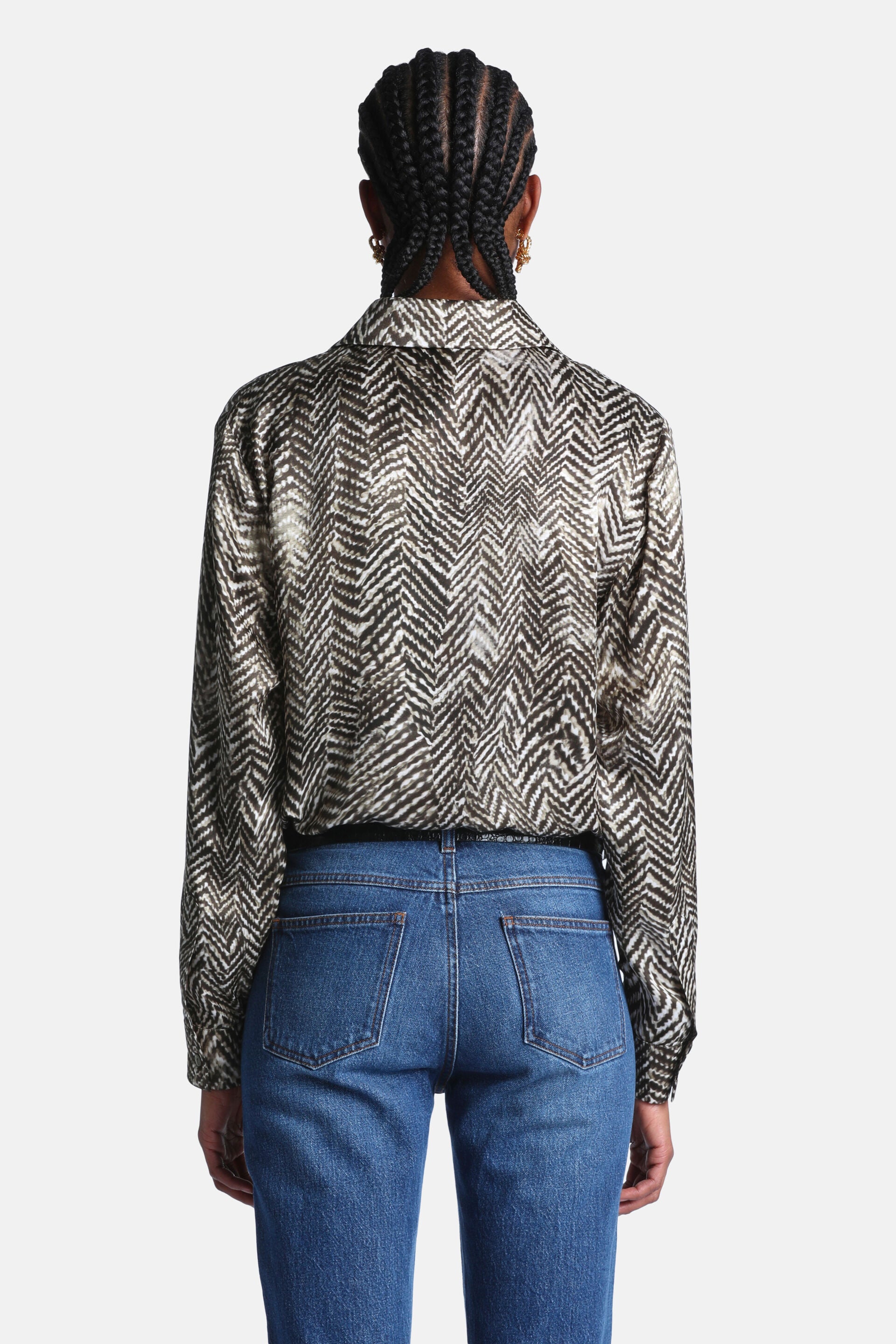 Dark green and off-white chevron pattern long-sleeved collared shirt.
