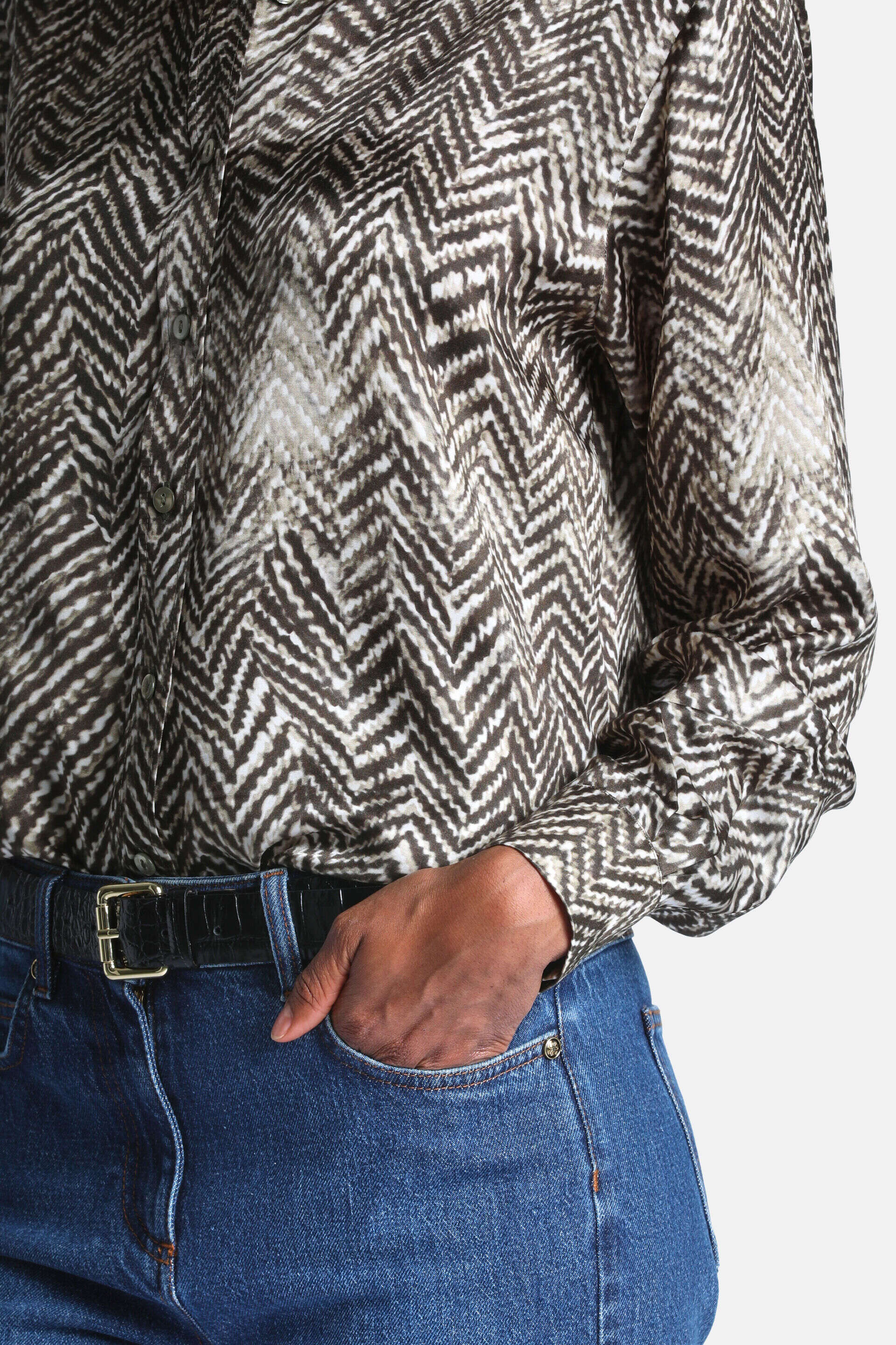 Dark green and off-white chevron pattern button-up shirt with long sleeves and gathered cuffs.