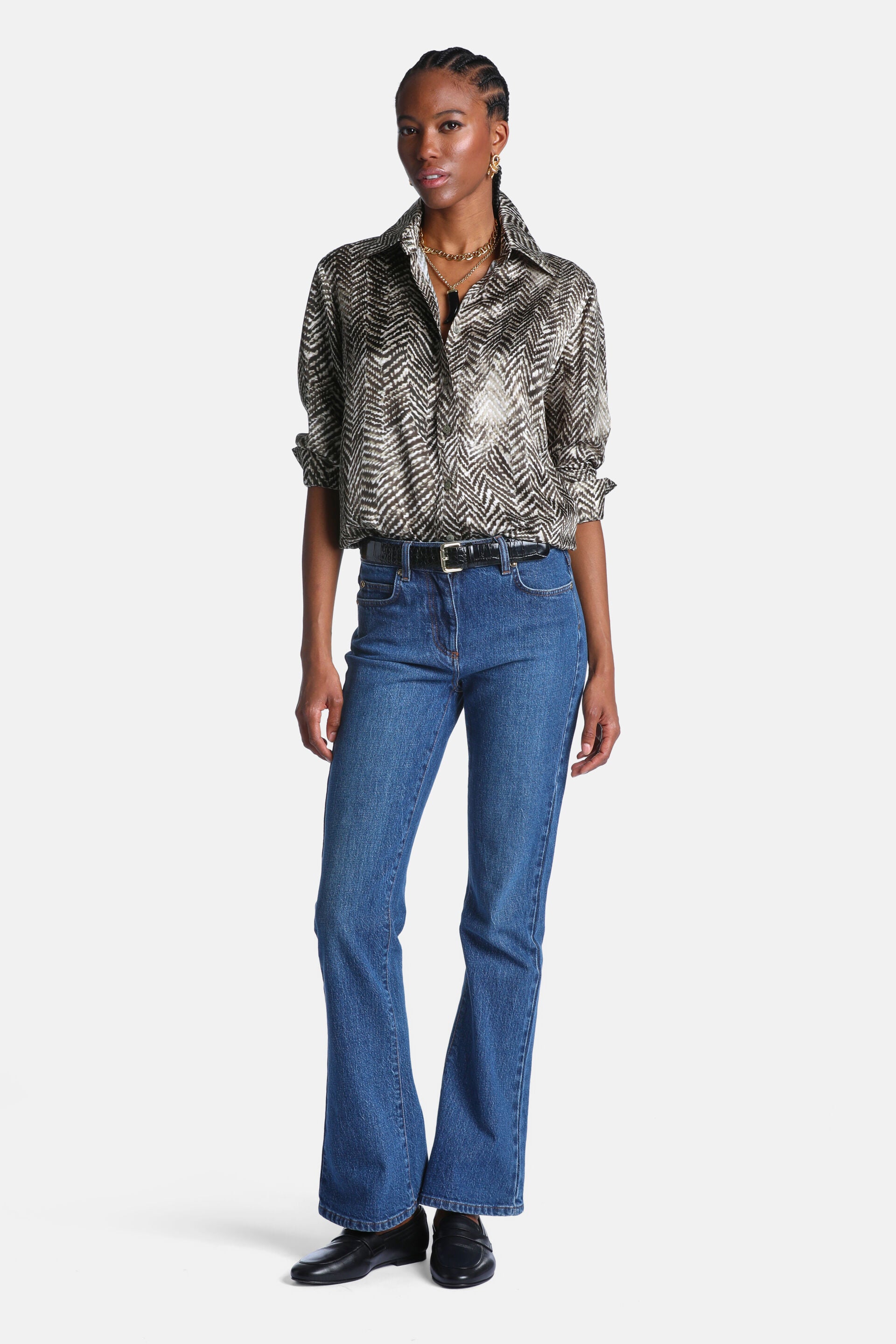 Shiny dark green and gold-toned chevron pattern button-up shirt with a collar and rolled long sleeves.