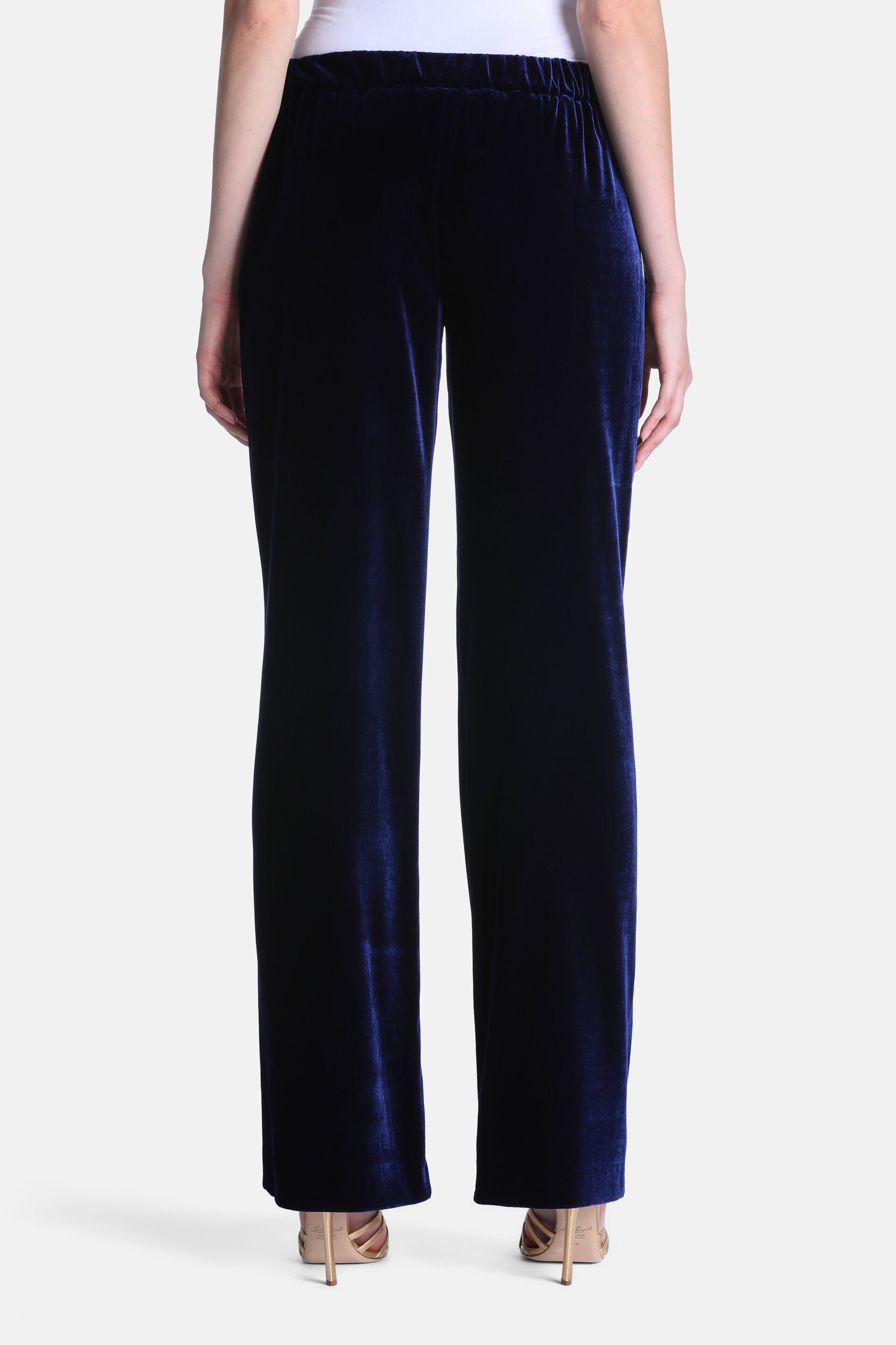Dark blue velvet trousers with a relaxed, straight-leg cut and an elasticated waist.