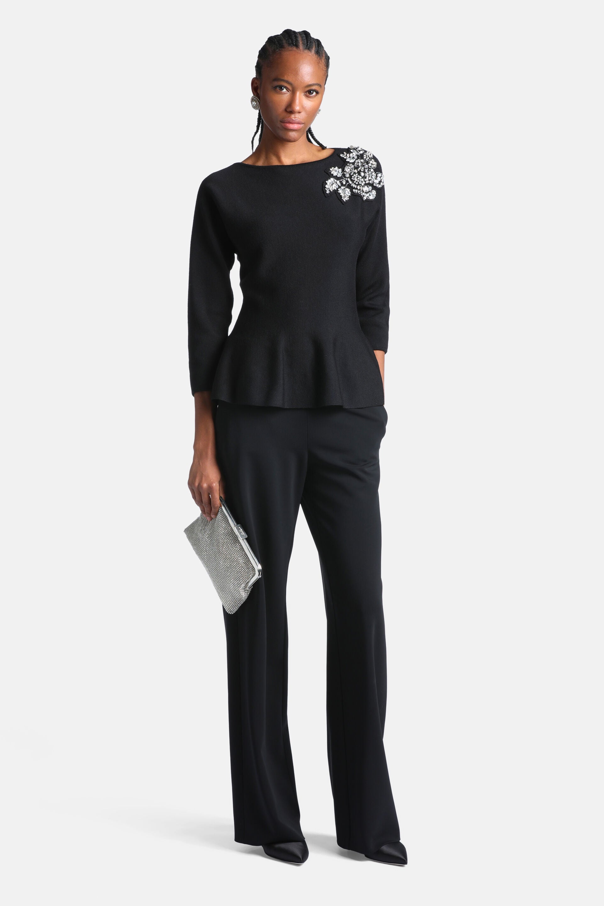 Black wide-leg trousers with a smooth waist and full-length hem.