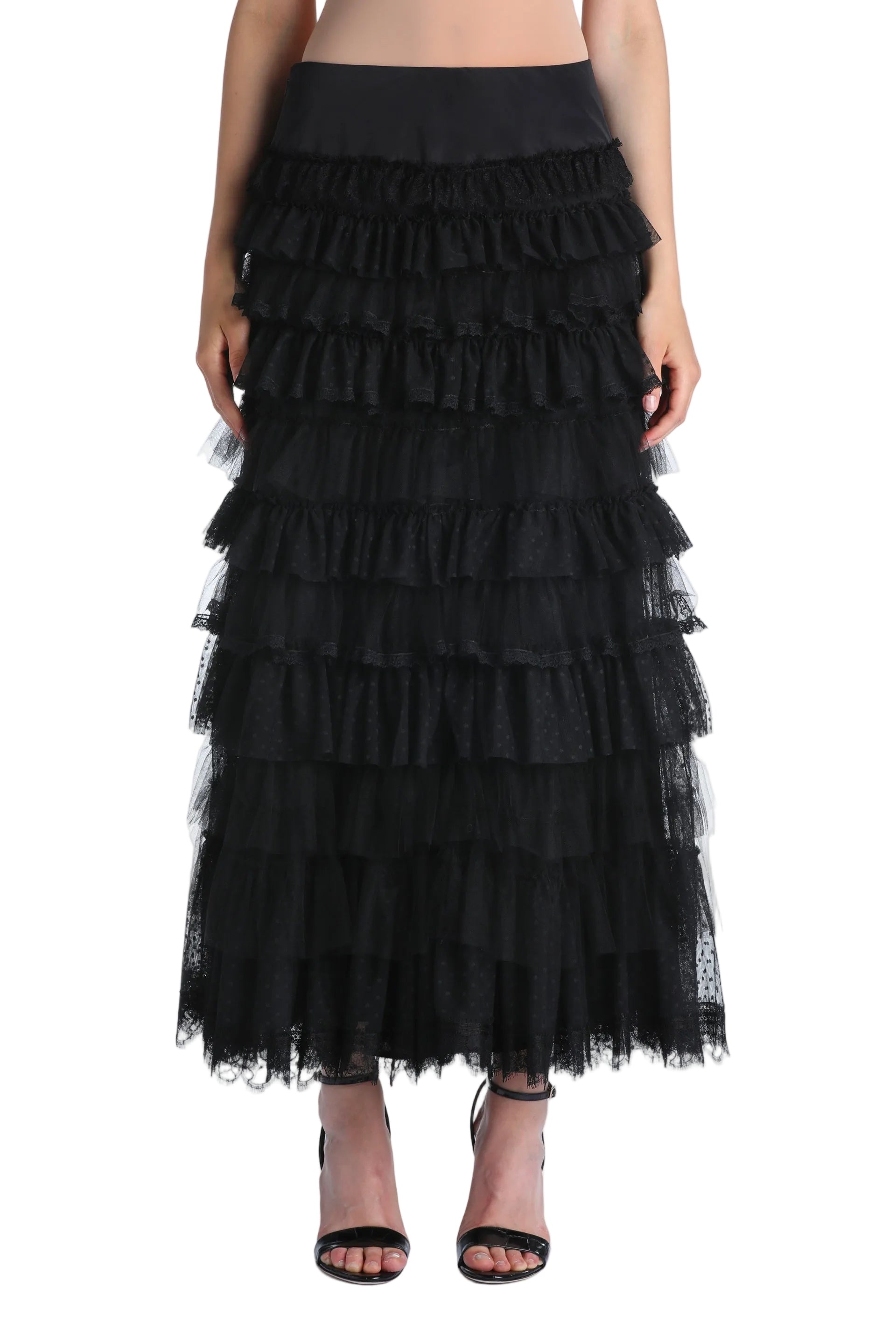 Black floor-length tiered ruffle skirt with a smooth waistband and sheer fabric featuring a subtle polka dot pattern.