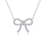 Silver-toned necklace with a bow-shaped pendant fully encrusted with clear, sparkling cubic zirconia stones.