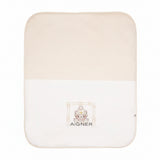 Beige and off-white knit baby blanket with a central graphic of a bear in a chain-link frame and 'AIGNER' text.