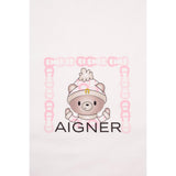 White blanket with a cartoon bear in a pink and white checkered hat with a gold-toned 'A' logo, framed by pink 'A' logos, and