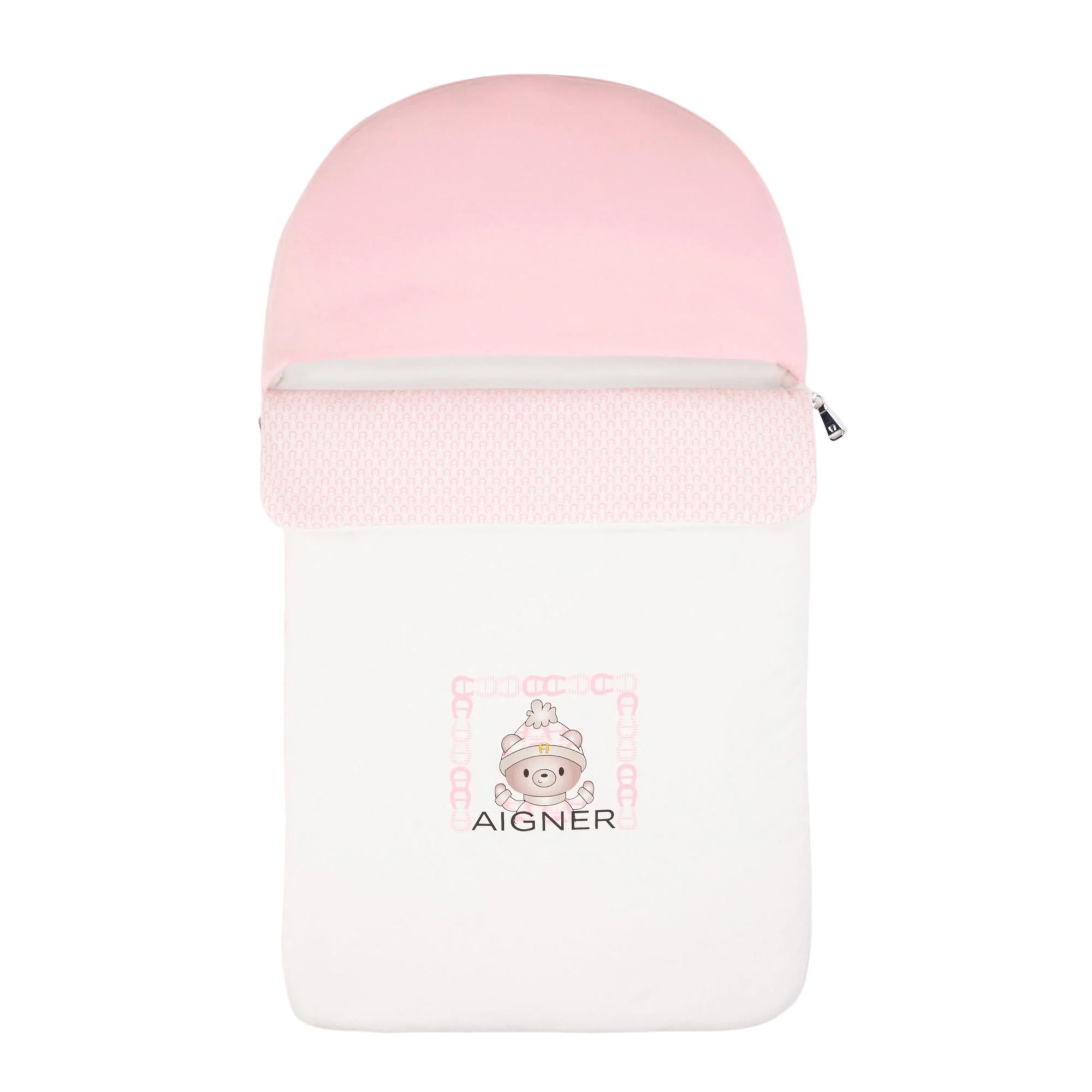 White and pink baby nest with a rounded hood, knitted pink trim, and a central graphic of a bear in a hat with an Aigner logo