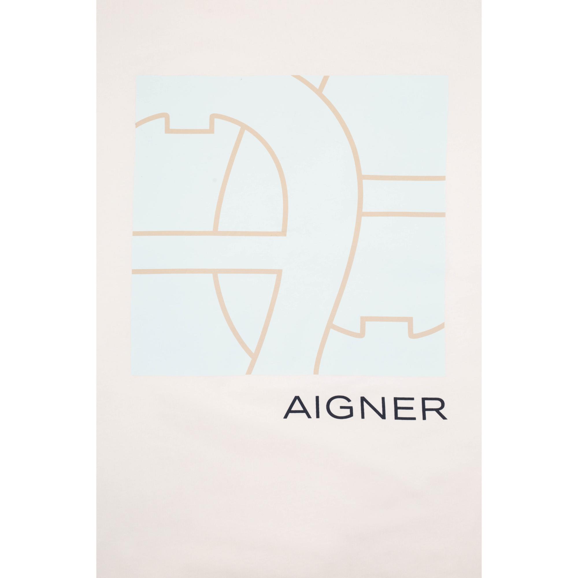 Beige blanket with a light blue square graphic featuring abstract beige lines and "AIGNER" text below.