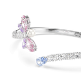 Silver-toned bangle. One end: white pearl, pink/purple marquise, clear stones in dragonfly design. Other end: clear stones, b