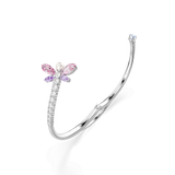 Silver-toned open bangle. One end has dragonfly with pink/purple gems, pearl head, clear gems. Other end has clear gem. Clear