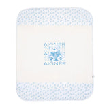 White and blue Aigner Kids baby blanket with a central blue teddy bear graphic and blue patterned borders.