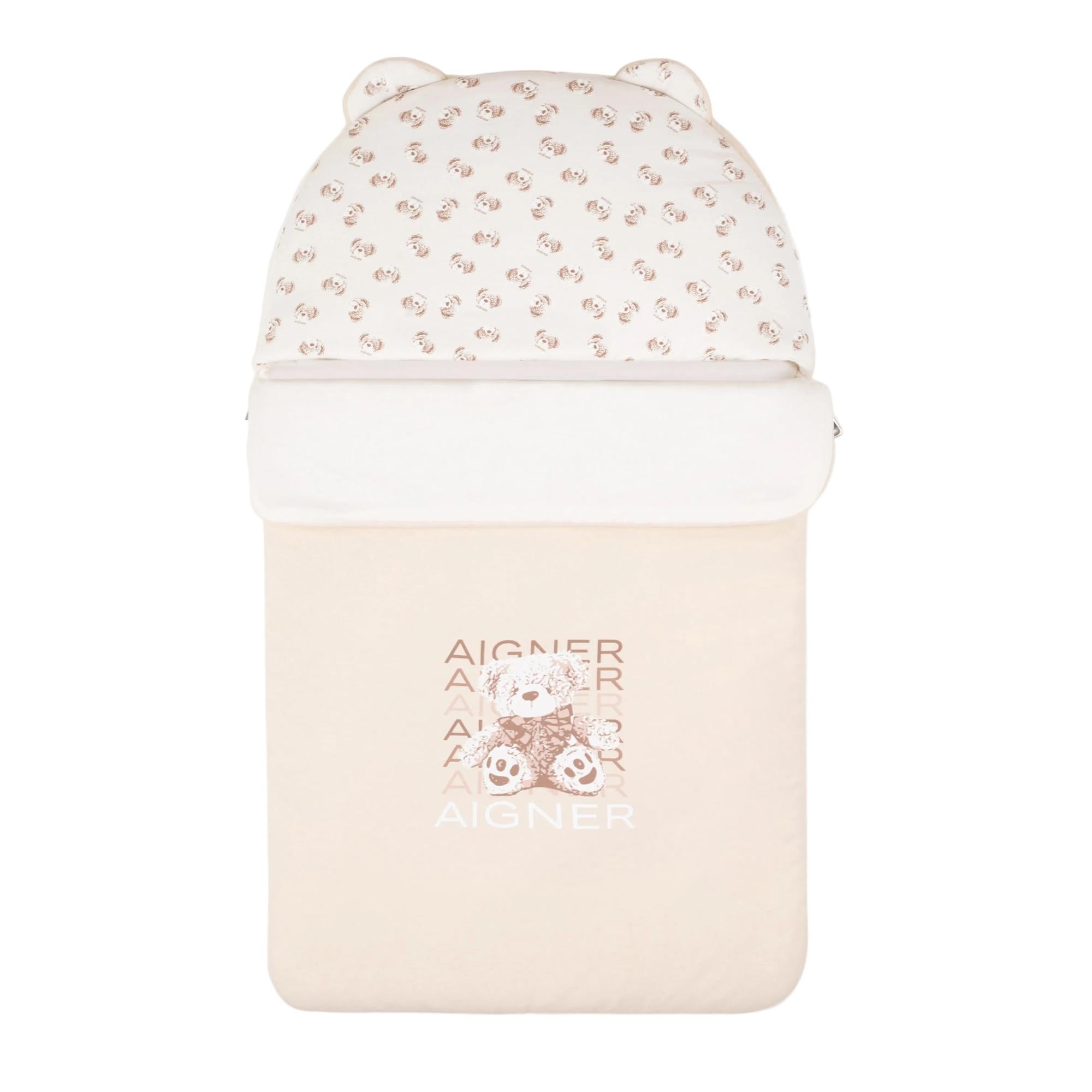 Beige baby nest with a hooded top featuring bear ears and a brown teddy bear graphic on the front.