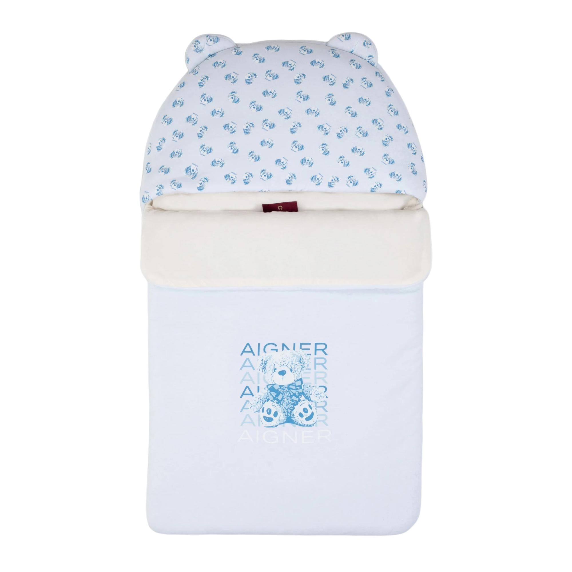 Light blue and white baby nest with a hooded top featuring small bear prints and a large teddy bear graphic on the main body.