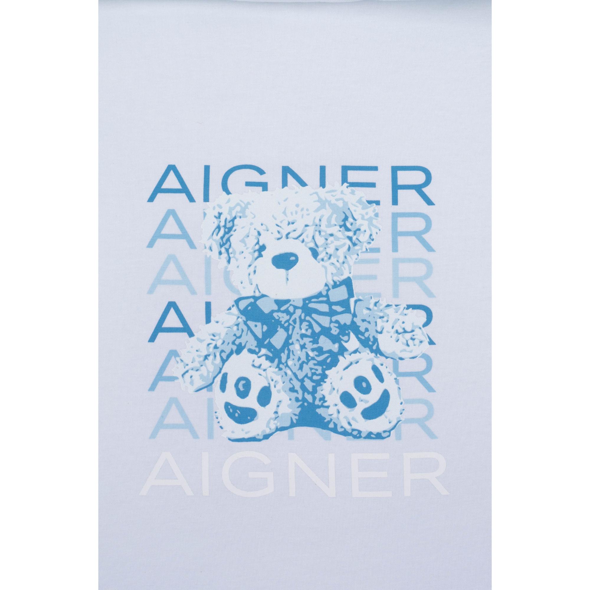 Light blue baby nest fabric with a blue teddy bear graphic wearing a checkered bow tie, layered with repeating 'AIGNER' text.