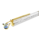 Clear pen with sparkling clear crystals, gold-toned clip and tip, and a Minion charm with blue crystal overalls and green/bro