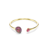 Gold-toned open bangle bracelet with one end featuring a cluster of pink pavé crystals and a central heart-shaped pink crysta