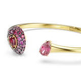 Gold-toned open bangle. One end: oval with pink crystals and a central dark pink pear. Other end: single pink pear crystal.