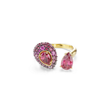 Gold-toned open ring with two pear-shaped pink stones. One is larger, surrounded by smaller pink and fuchsia stones on a dark