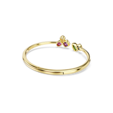Gold-toned open bangle with a cluster of clear, pink, and purple stones on one end, and green, blue, and yellow stones on the