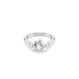 Silver-toned ring with a U-shaped band. A faceted iridescent star gem is centered between the band's ends, which are encruste