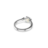 Silver-toned ring with a star-shaped iridescent stone at the center, flanked by small clear stones on the band.