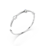 Silver-toned open bangle with two clear star crystals and one iridescent star crystal on one half, accented with pavé crystal
