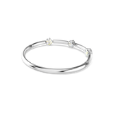Silver-toned bangle with three iridescent star-shaped charms. One end features a row of small clear crystals.