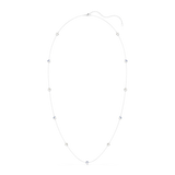 Long, delicate silver-toned chain necklace with alternating clear and light blue star-shaped charms. Adjustable clasp.
