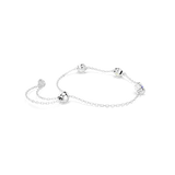 Silver-toned delicate chain bracelet with an adjustable slider closure. It features three cube charms with clear, light yello