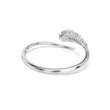Silver-toned open bangle with a smooth end and a curved end adorned with clear rectangular and round stones, plus small stone