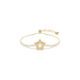 Gold-toned bolo bracelet with a star charm encrusted with yellow crystals and a central white crystal. White crystals line th
