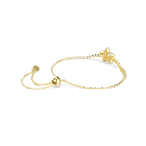 Gold-toned bolo bracelet with a crystal-encrusted star charm. One side of the chain is crystal-lined. It has an adjustable sl