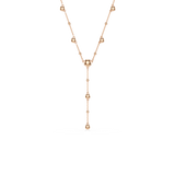 Rose gold-toned Y-necklace with a delicate chain featuring small, round beads and larger, smooth, round beads throughout.