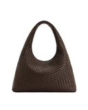 JW PEI Iaura woven shoulder bag in mocha brown with an integrated strap and soft, crescent shape.