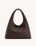 Mocha brown woven shoulder bag with a single wide, curved strap and a slouchy hobo body.