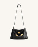 Black pebbled shoulder bag with a gold-toned rectangular twist-lock closure and two gold-toned buckle accents on the front.