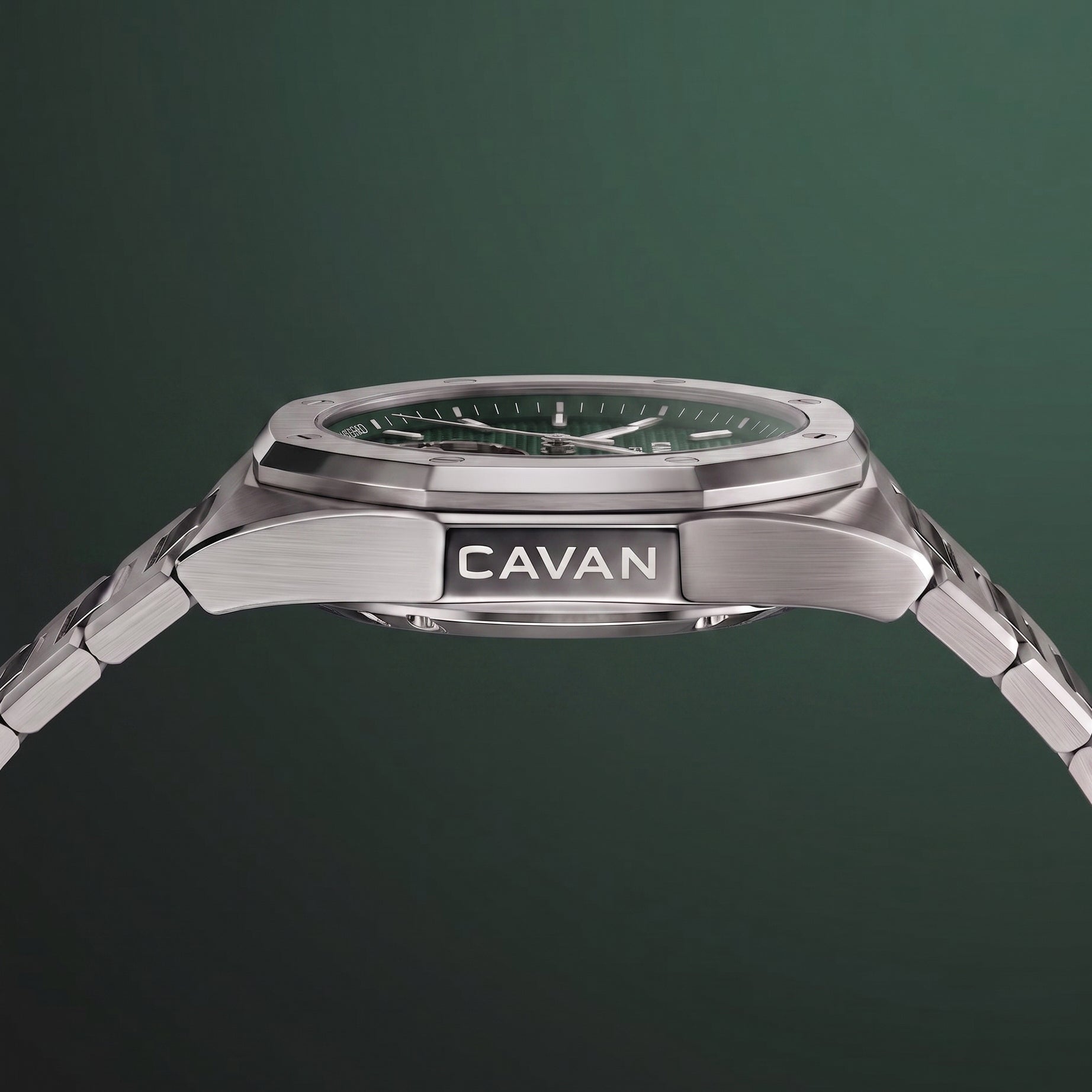 Silver-toned watch with an octagonal case, dark green textured dial, silver-toned hands and markers, and a metal link bracele